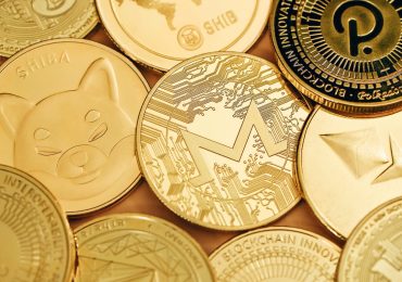 a close up of a pile of gold coins